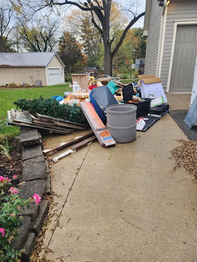 Dumpster being loaded with debris for 3 Yard Dumpster Rental in Bridgeton